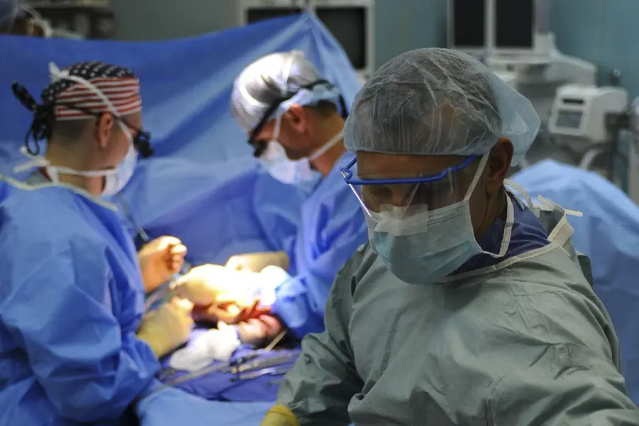 A group of surgeons in the operating room.